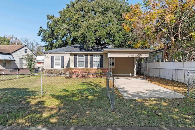 single story home featuring a carport and a front lawn