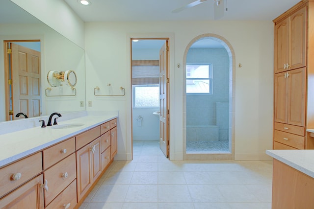 4 Oceanside Dr, Saint Augustine Beach, FL 32080 - bathroom with vanity, ceiling fan, a tile shower, tile patterned flooring, and recessed lighting