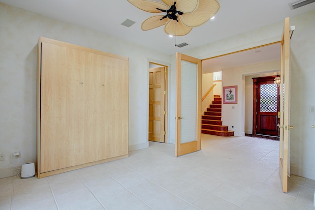 4 Oceanside Dr, Saint Augustine Beach, FL 32080 - spare room with a ceiling fan, stairs, french doors, and recessed lighting