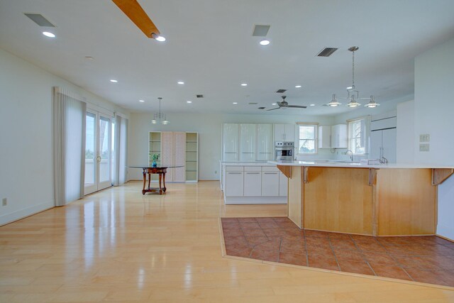 4 Oceanside Dr, Saint Augustine Beach, FL 32080 - kitchen featuring stainless steel oven, light countertops, recessed lighting, paneled built in refrigerator, and a ceiling fan