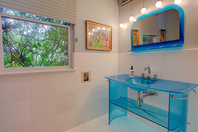 4 Oceanside Dr, Saint Augustine Beach, FL 32080 - bathroom featuring tile walls and wainscoting