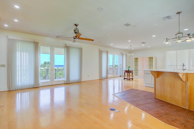 4 Oceanside Dr, Saint Augustine Beach, FL 32080 - kitchen with open floor plan, a ceiling fan, light countertops, recessed lighting, and light wood finished floors