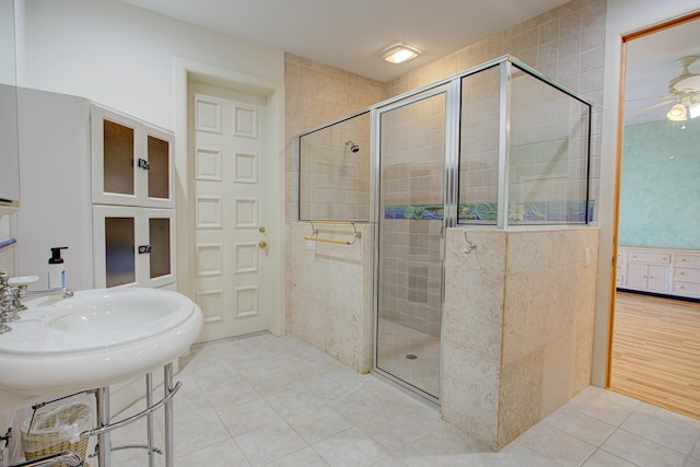 4 Oceanside Dr, Saint Augustine Beach, FL 32080 - bathroom with a stall shower, a ceiling fan, and tile patterned flooring
