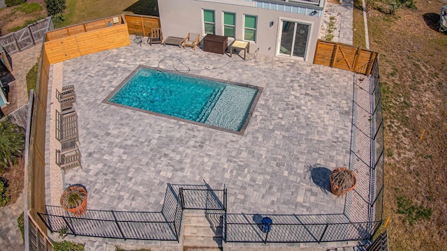 view of swimming pool with a patio