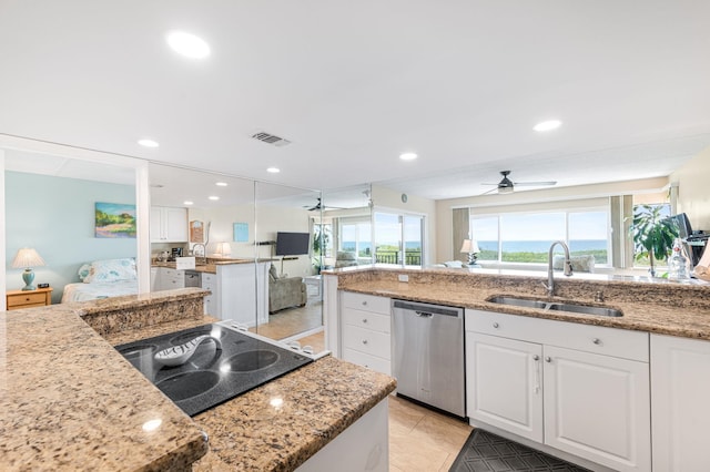 7780 S A1A Unit 101, Saint Augustine, FL 32080 - kitchen featuring stainless steel dishwasher, a ceiling fan, white cabinetry, open floor plan, and recessed lighting