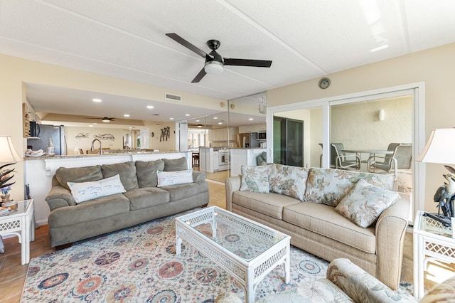 7780 S A1A Unit 101, Saint Augustine, FL 32080 - living room featuring a ceiling fan, light wood-style flooring, and recessed lighting