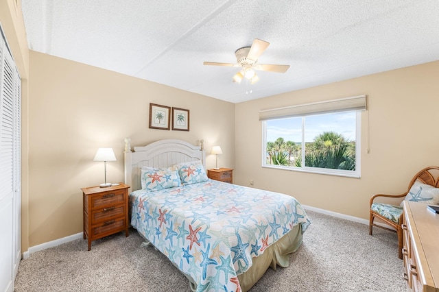 7780 S A1A Unit 101, Saint Augustine, FL 32080 - bedroom featuring carpet, a ceiling fan, a closet, and a textured ceiling