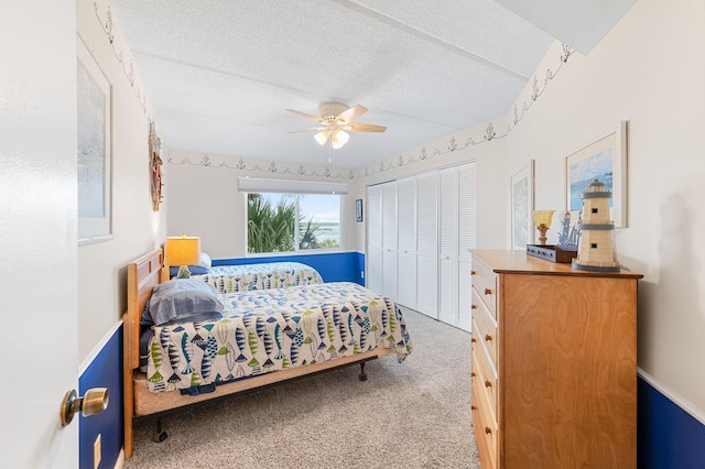 7780 S A1A Unit 101, Saint Augustine, FL 32080 - carpeted bedroom featuring a closet, a textured ceiling, and ceiling fan