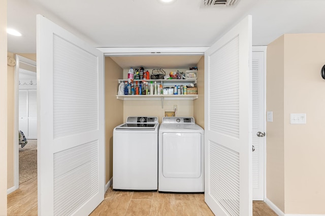 7780 S A1A Unit 101, Saint Augustine, FL 32080 - laundry room featuring washer and dryer and baseboards