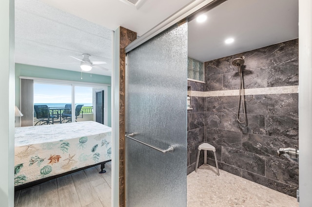 7780 S A1A Unit 101, Saint Augustine, FL 32080 - bathroom featuring tiled shower, a ceiling fan, wood finished floors, and recessed lighting
