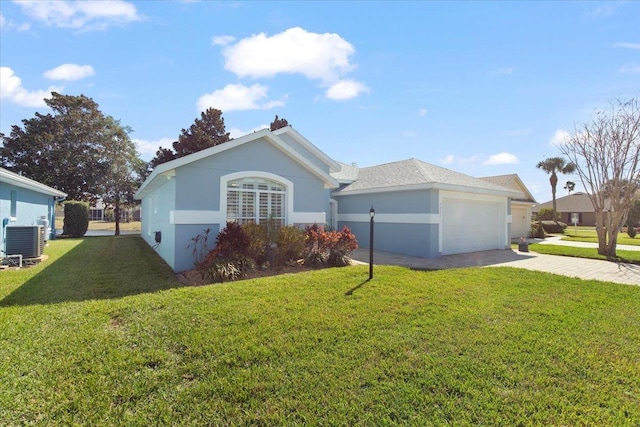 1021 Windward Way, Saint Augustine, FL 32080 - view of front of home with a front lawn, driveway, stucco siding, and a garage