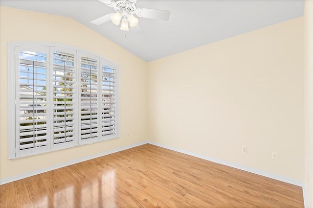 1021 Windward Way, Saint Augustine, FL 32080 - empty room with wood finished floors, a ceiling fan, and vaulted ceiling