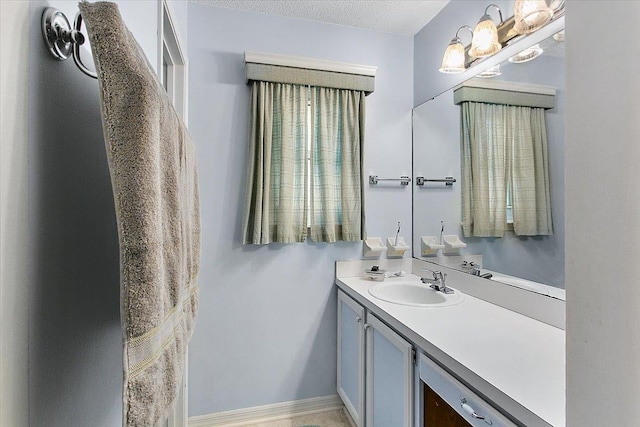 bathroom featuring vanity and a textured ceiling