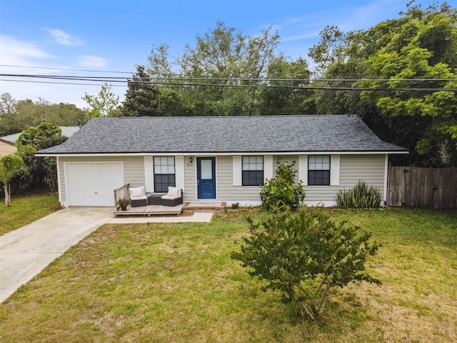 ranch-style house with a garage and a front lawn