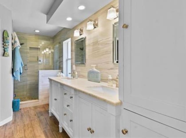 123 Whispering Oaks Cir, Saint Augustine, FL 32080 - full bath with recessed lighting, double vanity, a stall shower, and a sink
