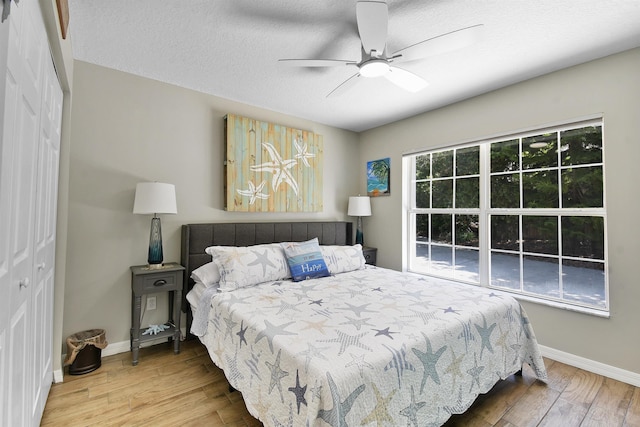 123 Whispering Oaks Cir, Saint Augustine, FL 32080 - bedroom featuring a closet, wood finished floors, visible vents, and a ceiling fan