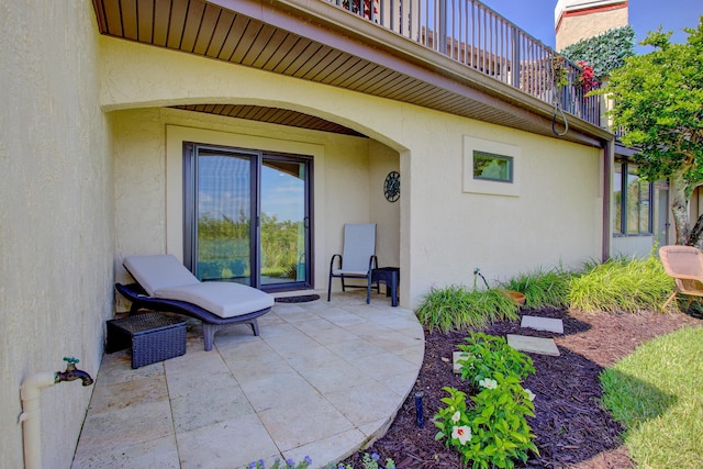 view of patio featuring a balcony