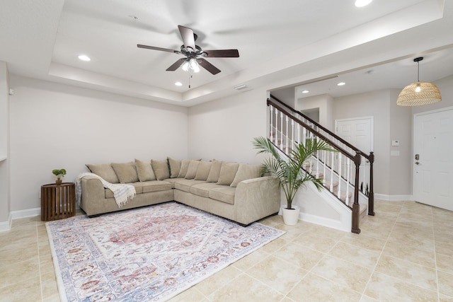 127 Adelanto Ave, Saint Augustine, FL 32092 - living room with a raised ceiling, stairway, a ceiling fan, light tile patterned floors, and recessed lighting