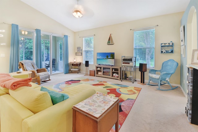 carpeted living room featuring vaulted ceiling and ceiling fan