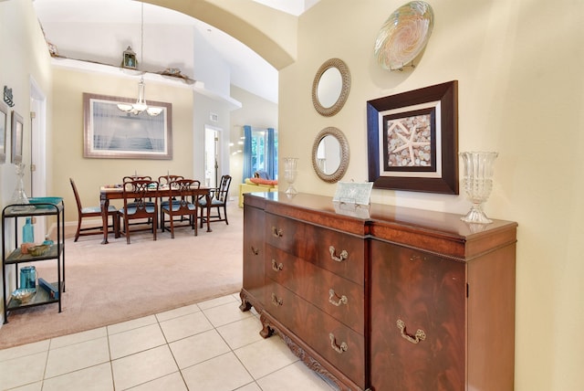 interior space featuring light colored carpet and lofted ceiling