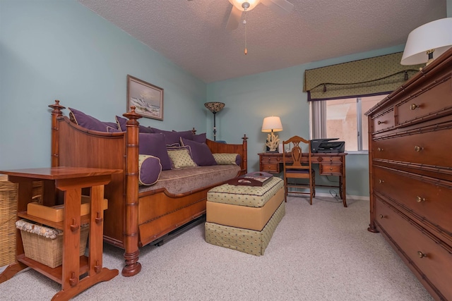 living room with light carpet, ceiling fan, and a textured ceiling