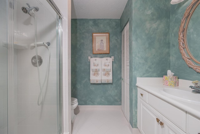 8130 A1A S H12, Saint Augustine, FL 32080 - full bathroom with a shower stall, vanity, tile patterned flooring, and a textured ceiling