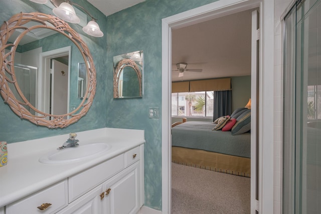 bathroom featuring vanity, ceiling fan, and an enclosed shower