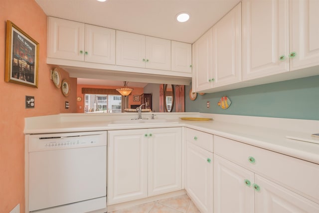 kitchen featuring dishwasher, white cabinets, sink, light tile patterned flooring, and kitchen peninsula