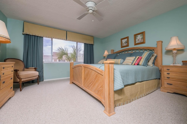 8130 A1A S H12, Saint Augustine, FL 32080 - carpeted bedroom with a ceiling fan and a textured ceiling