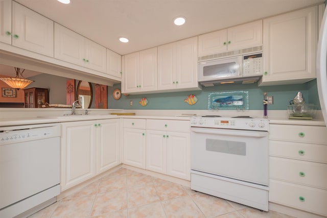 kitchen featuring white cabinetry, white appliances, sink, and light tile patterned floors