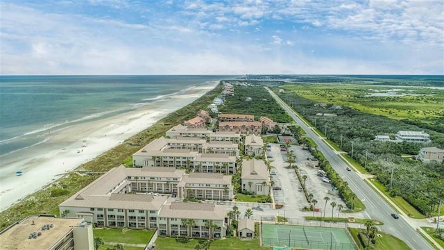 aerial view featuring a water view and a beach view