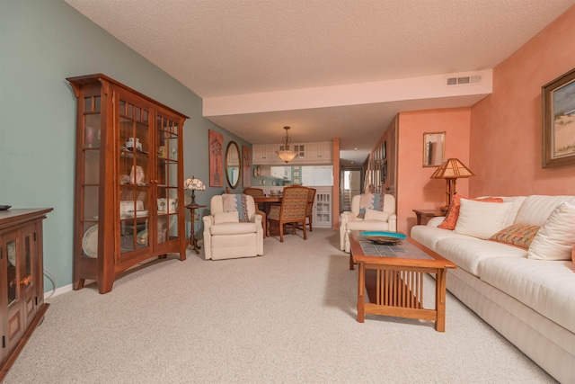 living room with carpet and a textured ceiling