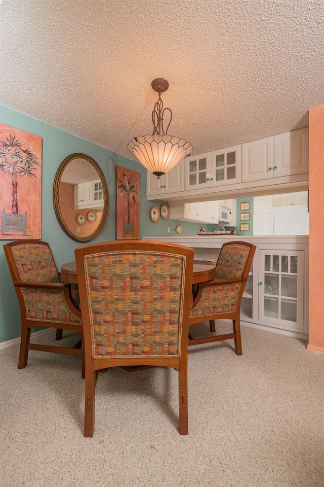 dining room with a textured ceiling