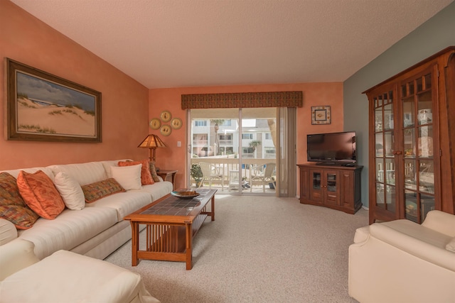 living room with light colored carpet and a textured ceiling