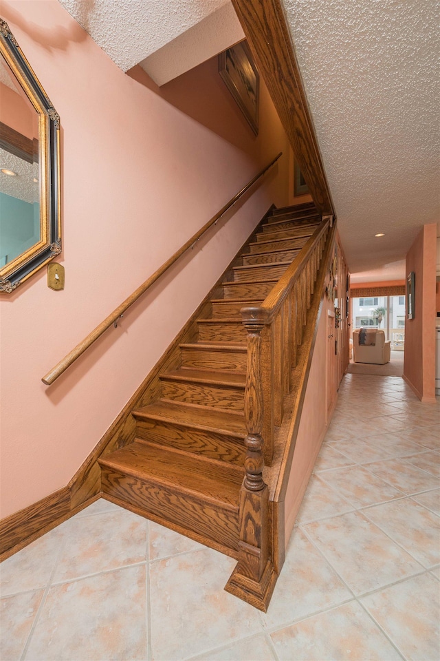 8130 A1A S H12, Saint Augustine, FL 32080 - stairs with a textured ceiling and tile patterned floors