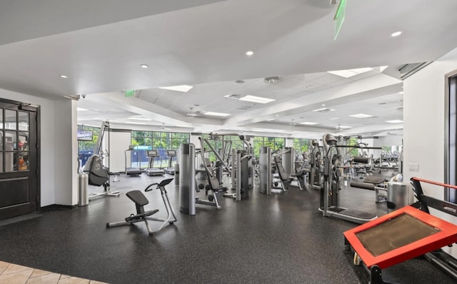 workout area featuring a drop ceiling