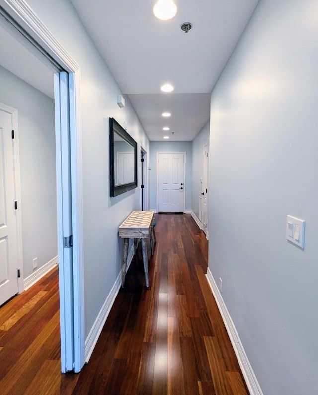 hall with dark hardwood / wood-style floors