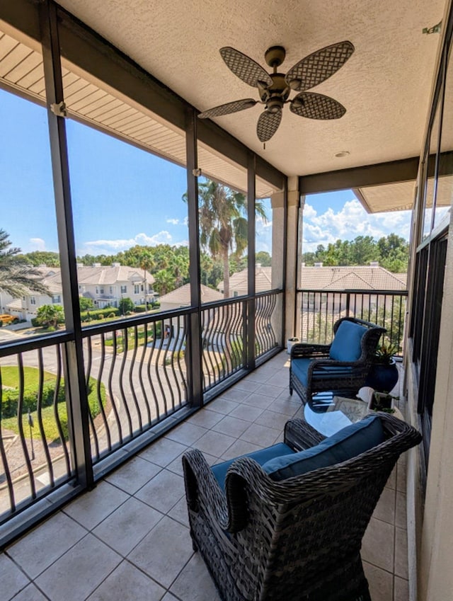 sunroom / solarium with ceiling fan