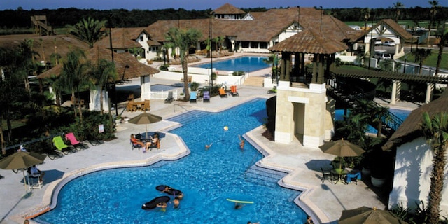 view of swimming pool with a gazebo and a patio