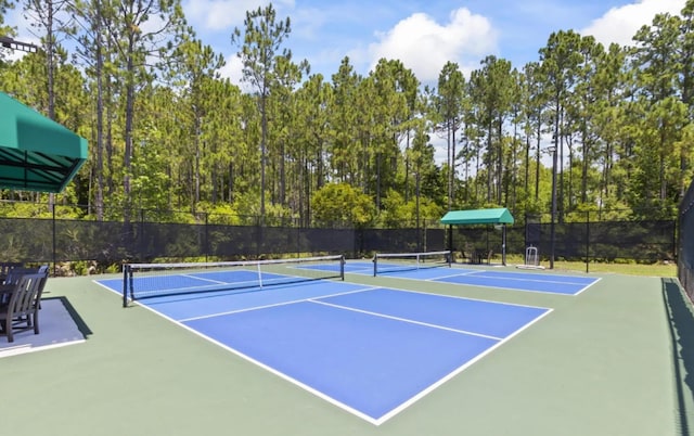 view of sport court with basketball hoop