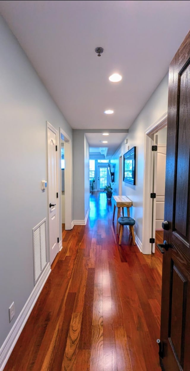 hallway featuring french doors and dark hardwood / wood-style floors