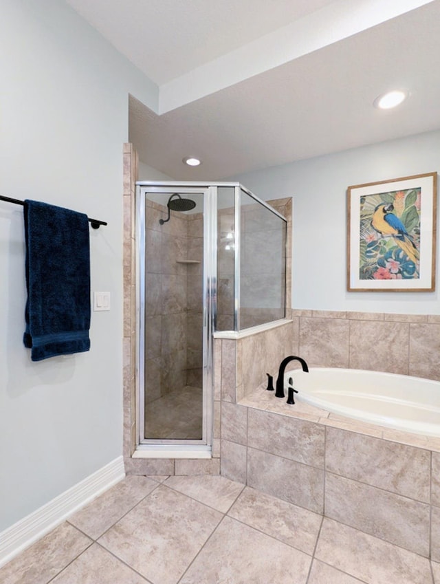 bathroom with tile patterned flooring and independent shower and bath