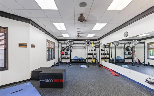 exercise area with a paneled ceiling