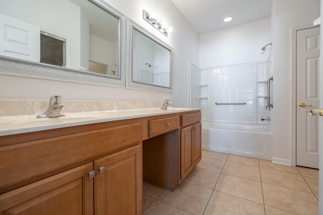 full bathroom with a sink, shower / bath combination, double vanity, and tile patterned flooring