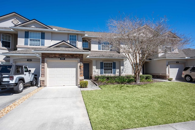 view of property with a garage, stucco siding, driveway, and a front yard