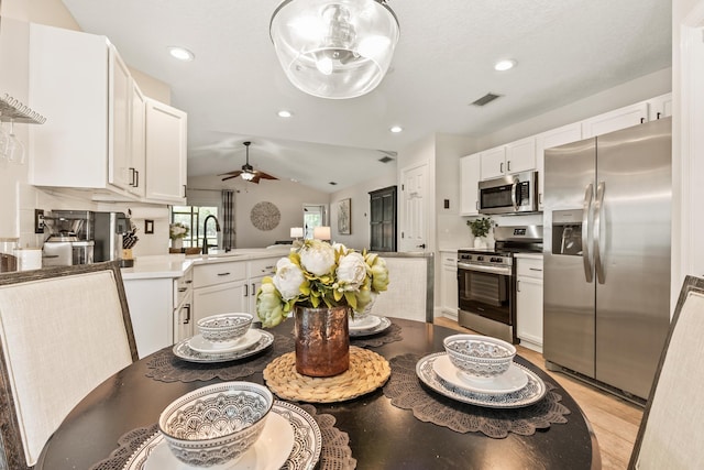 2077 W Lymington Way, Saint Augustine, FL 32084 - dining room featuring a ceiling fan, light wood-style floors, recessed lighting, and lofted ceiling