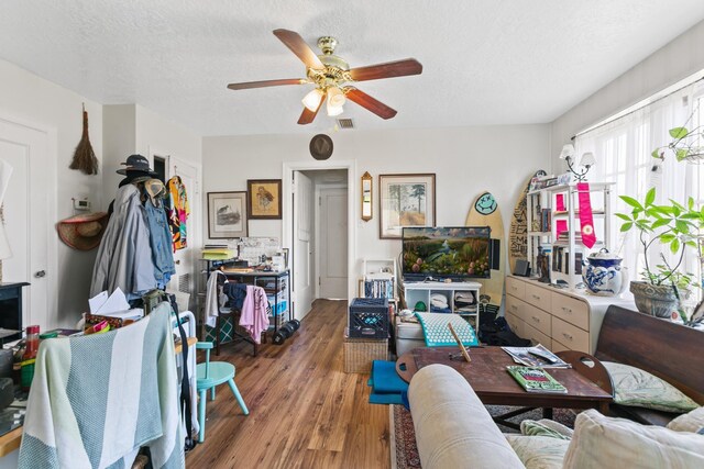 85 N Saint Augustine Blvd Unit 1, Saint Augustine, FL 32080 - living area featuring ceiling fan, wood finished floors, and a textured ceiling