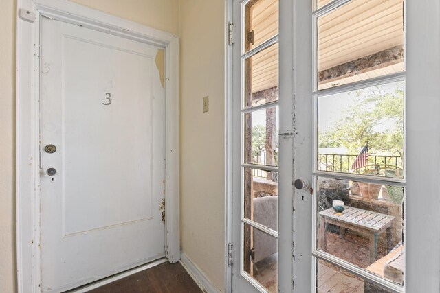 85 N Saint Augustine Blvd Unit 1, Saint Augustine, FL 32080 - entryway featuring baseboards, healthy amount of natural light, and dark wood-style flooring