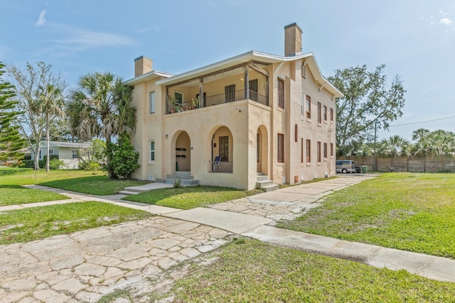 85 N Saint Augustine Blvd Unit 1, Saint Augustine, FL 32080 - mediterranean / spanish home with a balcony, a chimney, and stucco siding