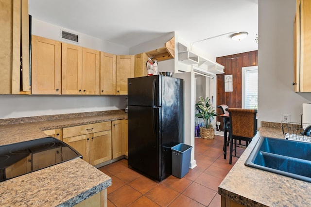 85 N Saint Augustine Blvd Unit 1, Saint Augustine, FL 32080 - kitchen with black appliances, light brown cabinetry, a sink, tile patterned floors, and light countertops